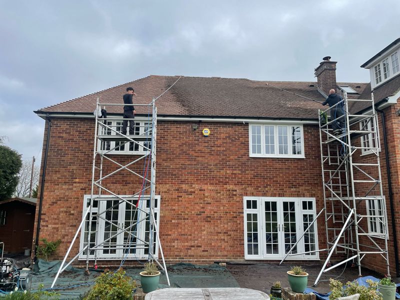 Roof cleaning carried out safely from scaffold towers by The Roof Moss Cleaners in Wootton